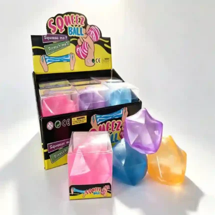 Masonry Ice Squishy Stress Ball in pink, blue, purple, and orange translucent colours, individually boxed and displayed in a retail countertop display.