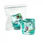Transparent Ocean Ice Cube Squishy Stress Toy with colourful sea life decorations, supplied in a reusable zip-lock pouch. Slow-rising sensory fidget toy available from SDMAX Toys Wholesaler UK.