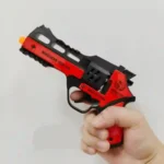 Red and black cowboy-style 8 shot ring cap toy revolver in retail blister packaging by SDMAX Toys Wholesaler UK