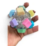 12-Key Mechanical Keyboard Fidget Ball featuring pastel keycaps, tactile mechanical switches, transparent housing and integrated LED lights from SDMAX Toys Wholesaler.
