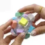 12-Key Mechanical Keyboard Fidget Ball featuring pastel keycaps, tactile mechanical switches, transparent housing and integrated LED lights from SDMAX Toys Wholesaler.
