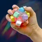 12-Key Mechanical Keyboard Fidget Ball featuring pastel keycaps, tactile mechanical switches, transparent housing and integrated LED lights from SDMAX Toys Wholesaler.