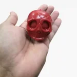 Skull Squish Crunchy Squeeze Toy, 6.5x5.5cm, available in red, black and white. 12 pieces per box, ideal for toy shops, party bags, gifts and resale