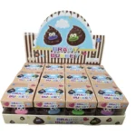 Brady Bubeey brown poop-shaped squishy toy with pink smile, individual packaging and 12-piece wholesale display by SDMAX Toys Wholesaler.