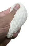 Noodle Squishy Toy, 8×8cm, with a textured white design. Wholesale box of 12 for toy shops, gift stores and resellers. Shop SDMAX Toys Wholesaler.