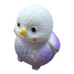 Crunchy Bird Squishy Toy in white and purple with textured surface, individual retail packaging and 12-piece wholesale display by SDMAX Toys Wholesaler