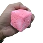 Colourful Crunchy Candy Cube Squishy Toys in pink, purple, yellow, blue and white, approximately 7 × 7 cm, displayed in a 12-piece wholesale box from SDMAX Toys Wholesaler.