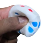 Crunchy Dice Squishy Toy with red and blue spots, 4.5 x 4.5 cm, 12 pieces per box, SDMAX Toys Wholesaler.
