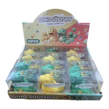 Crunchy Dino Squishy Toy in yellow and green, 7 × 8 cm, displayed in a 12-piece wholesale box by SDMAX Toys Wholesaler.