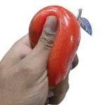 Shop Slush Apple Squishy Toys wholesale at SDMAX. Glittery apple design, 6.5 × 7 cm, 12 pieces per box. Ideal for toy shops and resellers.