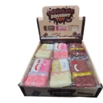 Chocolate bar-shaped squishy novelty toys in brown, pink and cream, individually wrapped and displayed in a wholesale box of 12.