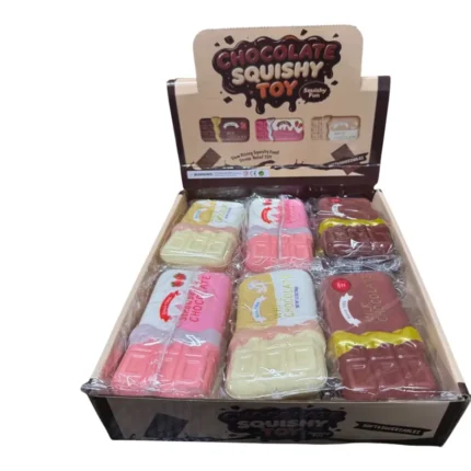 Chocolate bar-shaped squishy novelty toys in brown, pink and cream, individually wrapped and displayed in a wholesale box of 12.