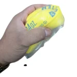 Giant yellow stick of butter squishy toy measuring 23 × 4 cm, displayed with wholesale packaging, priced at £2.65 each in a box of 12 by SDMAX Toys Wholesaler.
