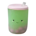 Green Matcha Squish-Tea strawberry scented squishy toy with pink lid, smiling face, retail packaging and wholesale box of 12 from SDMAX Toys Wholesaler.
