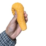 Jumbo fried chicken drumstick squishy toy in golden orange with a bumpy crispy-style texture, retail display box of 12, £2.99 each, SDMAX Toys Wholesaler.