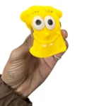 Crunchy Sponge Squishy Toy featuring a yellow square smiling character with large eyes, individual retail packaging and a 12-piece wholesale display box from SDMAX Toys Wholesaler.