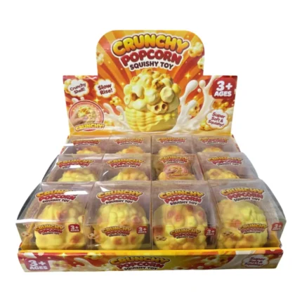 Crunchy Popcorn Squishy Toy in yellow with orange popcorn details, individual retail packaging and 12-piece wholesale display box from SDMAX Toys Wholesaler.