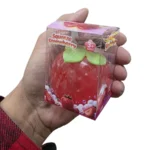 Vaseline Strawberry Squishy Toy in red strawberry design with green leaves, individual retail packaging and 12-piece wholesale display box, priced at £2.75 each by SDMAX Toys Wholesaler.