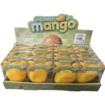 Vaseline Ripe Mango Squishy Toy in bright yellow mango design, shown being squeezed beside its individual retail box and 12-piece wholesale display, £2.50 each from SDMAX Toys Wholesaler.