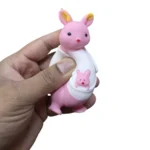 Cute Kangaroo Squishy Toy in pink, white and brown with baby kangaroo in pouch, individual packaging and wholesale display box, 10.5 × 5.5cm, £2.85 each – SDMAX Toys Wholesaler.