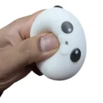 Crunchy Panda Squishy Toy with a white round face, black ears and eye patches, individual packaging and wholesale display box, 7 × 5cm, £2.65 each and 12 pieces per box – SDMAX Toys Wholesaler.