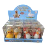 Cute Duck Squishy Toy featuring a yellow duck with an orange beak, brown floppy details, blue hat and blue outfit, individual packaging and wholesale display box, 10 × 6cm, £2.85 each – SDMAX Toys Wholesaler.
