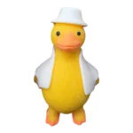 Cute Duck Squishy Toy featuring a yellow duck with an orange beak, brown floppy details, blue hat and blue outfit, individual packaging and wholesale display box, 10 × 6cm, £2.85 each – SDMAX Toys Wholesaler.