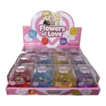 Flowers of Love rose-shaped novelty squeeze toys in red, blue, yellow and purple, displayed in a pink box of 12 by SDMAX Toys Wholesaler.