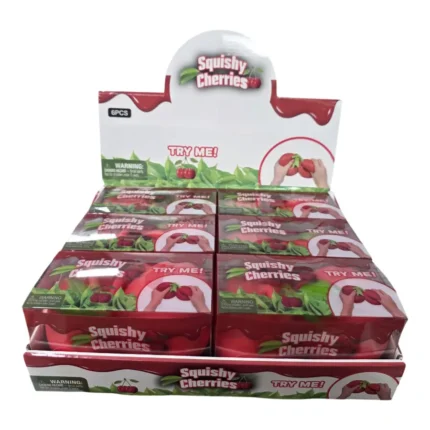 Jumbo red double cherry squishy toy with green stem, approximately 16 × 15 cm, shown with retail packaging and wholesale display box of 6.