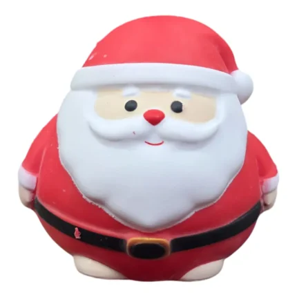 Jumbo Santa Claus squishy squeeze toy in a red Christmas suit and white beard, approximately 15 × 15cm, shown with festive packaging and wholesale display box.