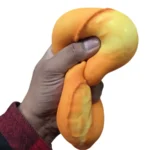 Jumbo scented deep-fried dough stick squishy toy in golden orange, approximately 22cm long, with retail packaging and wholesale display box from SDMAX Toys Wholesaler.