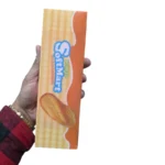 Jumbo scented deep-fried dough stick squishy toy in golden orange, approximately 22cm long, with retail packaging and wholesale display box from SDMAX Toys Wholesaler.