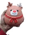 Jumbo Christmas reindeer squishy toy with red scarf, 15 × 14 cm, displayed with wholesale packaging from SDMAX Toys Wholesaler.