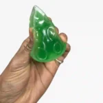 Triangle cheese squishy squeeze toys in yellow and green with 12-piece wholesale display box by SDMAX Toys Wholesaler.