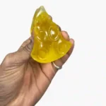Triangle cheese squishy squeeze toys in yellow and green with 12-piece wholesale display box by SDMAX Toys Wholesaler.